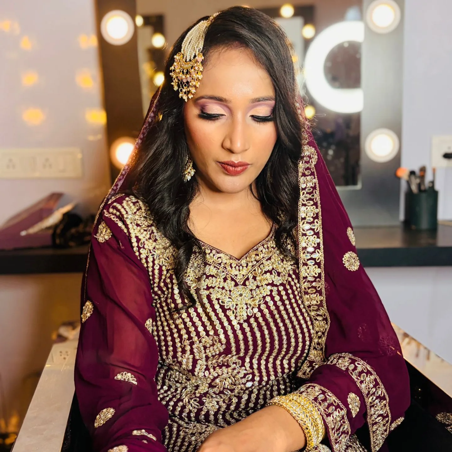 Maroon bridal makeup with gold embroidery — Patna