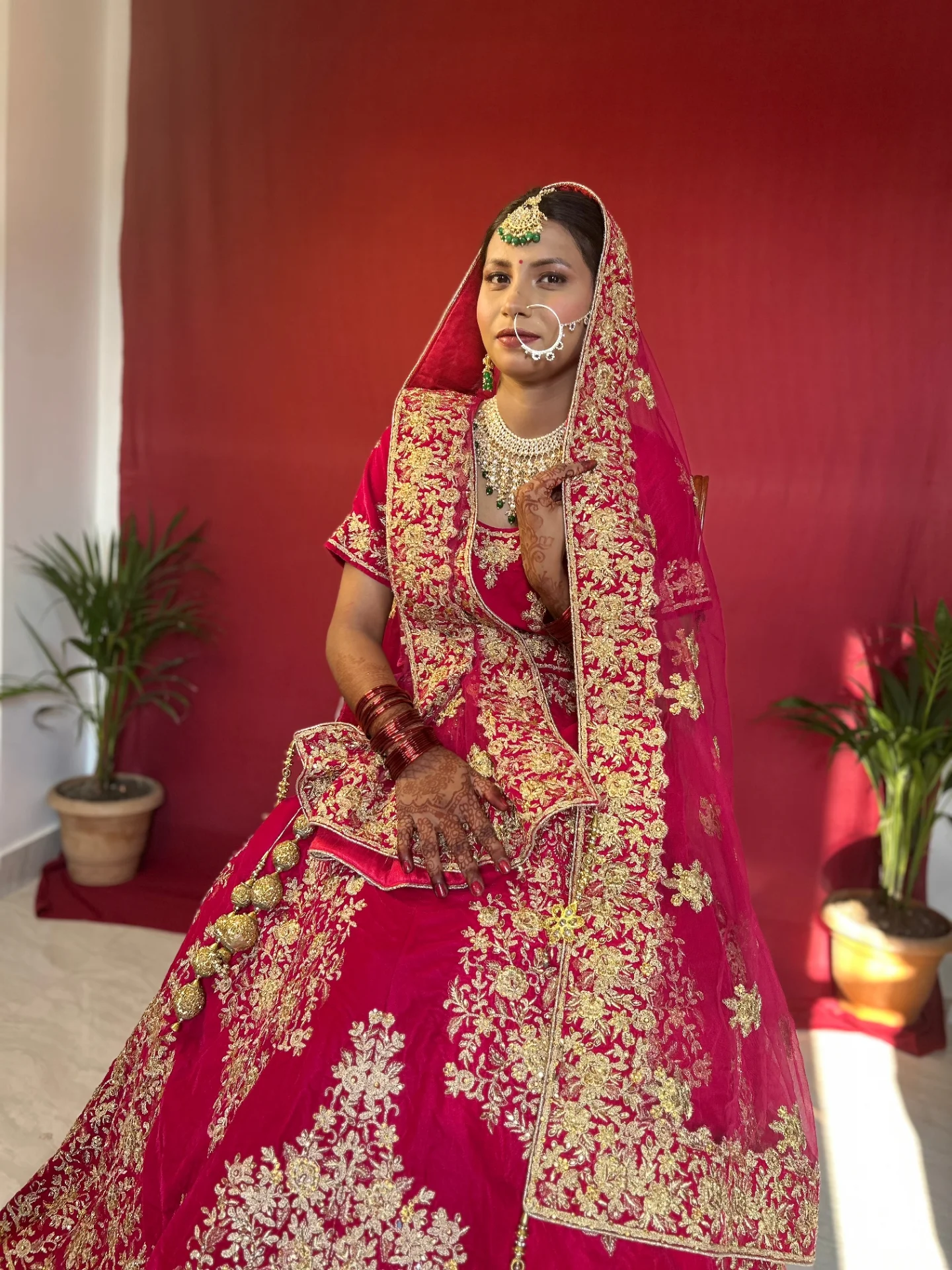 Red bridal seated portrait — Therounak Patna